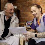 Patient discussing medication with caregiver.